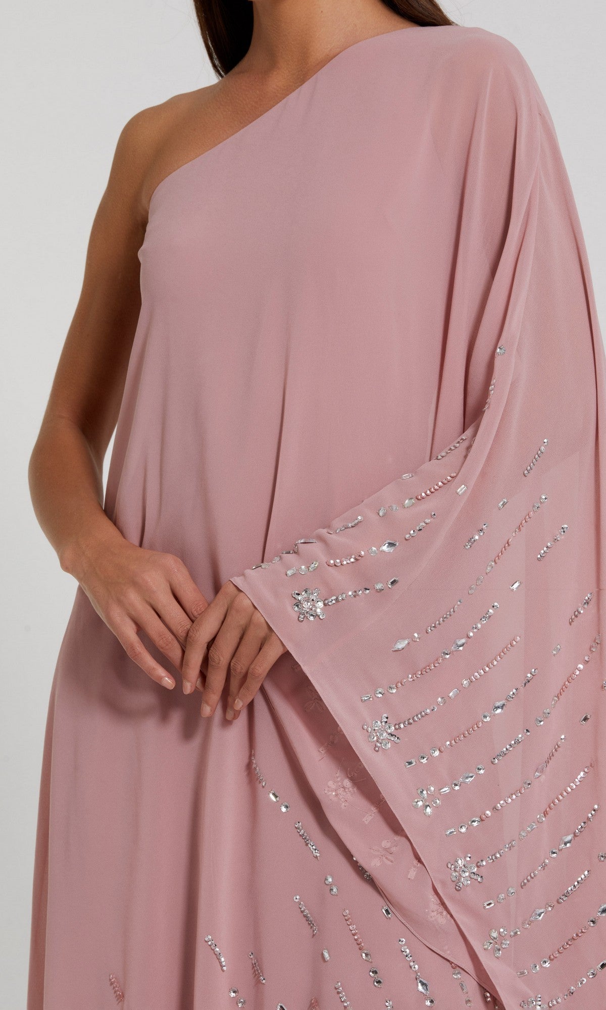 A person models the Mac Duggal 9517 Long Formal Dress—a pink, one-shoulder gown adorned with silver sequin embellishments—standing against a plain background, capturing the brand’s signature elegance.